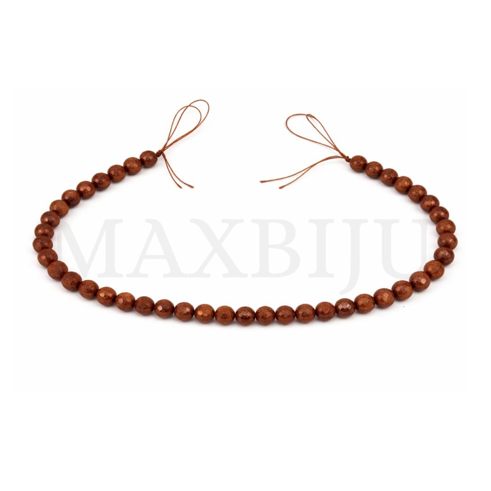 Strands of 8mm faceted gold sand beads.